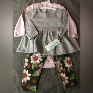 NWT. 3 piece set by Carters.Size 12months.Includes leggings, onesie, & shirt